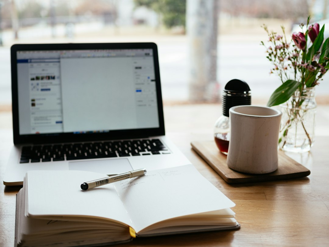 Laptop and notebook on a desk illustrating content planning