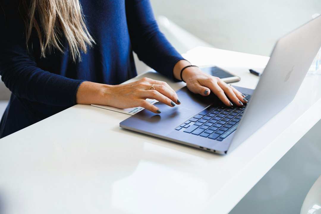 Professional using a laptop, illustrating customer feedback management
