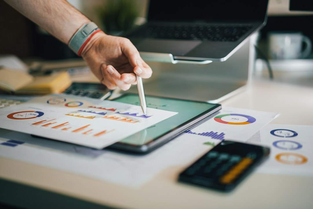 Illustrative analytics and expense charts on a workspace desk