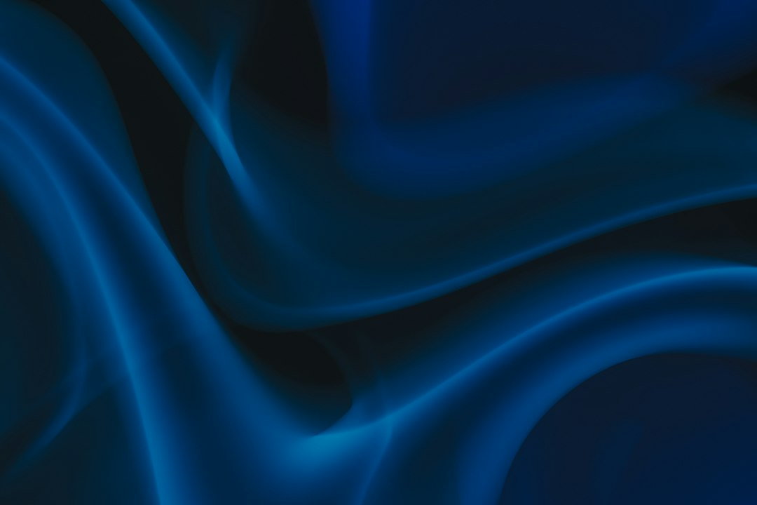 Abstract navy and blue curved forms illustrating visual storytelling and motion
